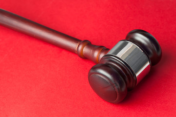 Gavel on a red background