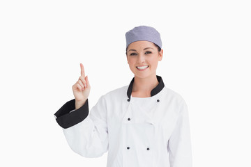 Smiling chef pointing up