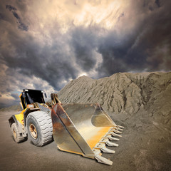 Excavator in the mine. Ecology disaster concept.