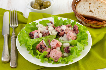 seafood salad on the plate with bread