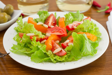 vegetables salad with pine nuts on the plate