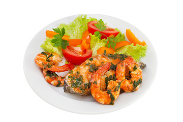 fish with seafood and salad on the plate on white background