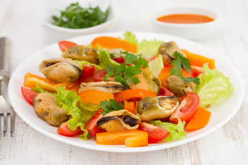 salad with shrimps on the white plate