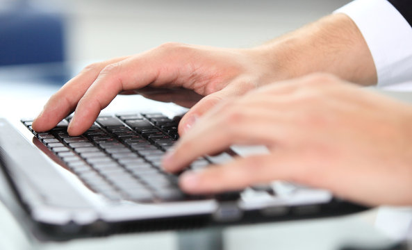 Close-up of typing male hands