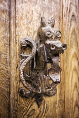 Beautiful dragon shaped door knocker in Pedraza, Segovia, Spain