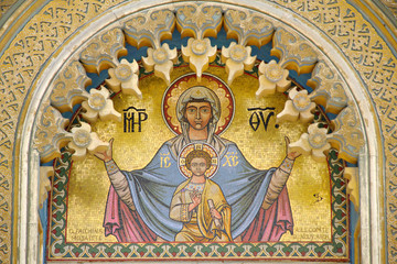 Iconic golden mosaic of Mary and child Jesus