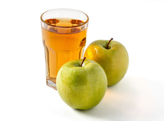 Glass of apple juice and green apples