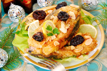 breaded carp with almonds and prune for christmas
