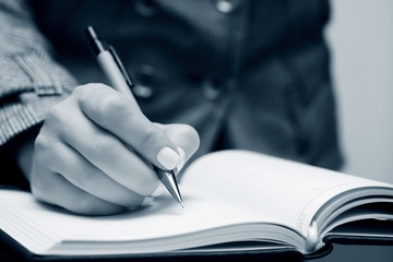 Businesswoman writing