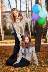Young girls in an autumn park