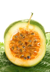 green passion fruit on white background close-up