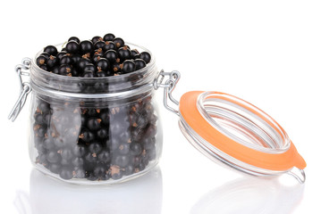 Black currant in glass isolated on white