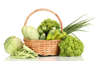 fresh green vegetables in basket isolated on white