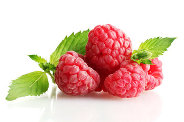 ripe raspberries with mint  isolated on white