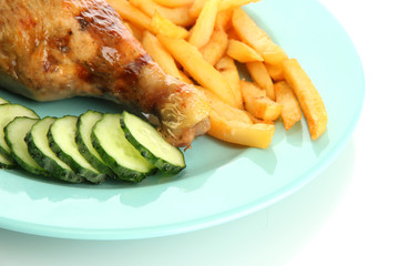 Roast chicken with french fries and cucumbers