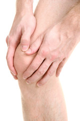 man holding sore knee, isolated on white