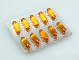 Capsules packed in blisters, isolated on white