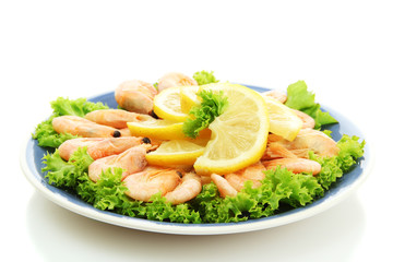 Boiled shrimps with lemon and lettuce leaves