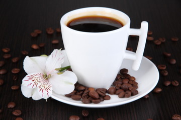 White cup of Turkish coffee on wooden table