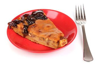 Tasty pie on red plate isolated on white