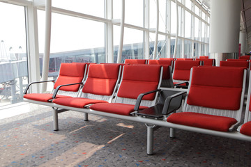 Naklejka premium red chair at airport