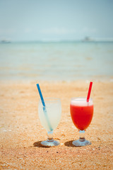 Pair of fruit shakes on the tropical beach 