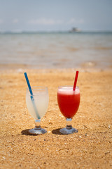 Pair of fruit shakes on the tropical beach 