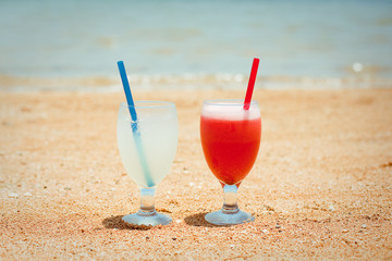 Pair of fruit shakes on the tropical beach 