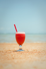 Fresh fruit cocktail on a tropical island beach