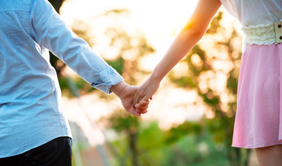 Couple holding hands