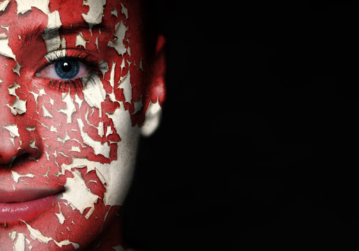 Woman Face Covered With Old Cracked Red Paint