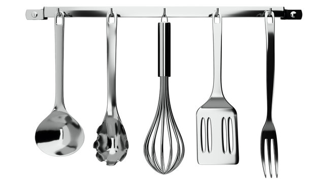kitchen utensils hanging on white background