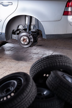 inside a garage - changing wheels/tires