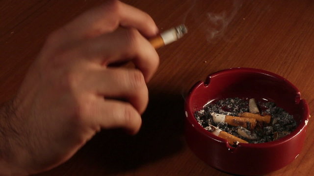End fag , butt cigarette , ashtray grunge background