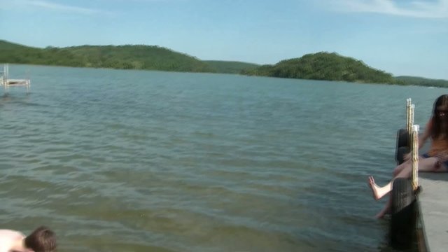 Boy with Mother at Lake Playing with Water