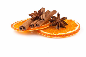 orange slices, cinnamon and anise isolated on white
