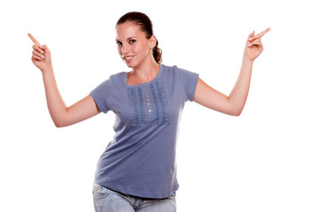 Charming young woman pointing up looking at you