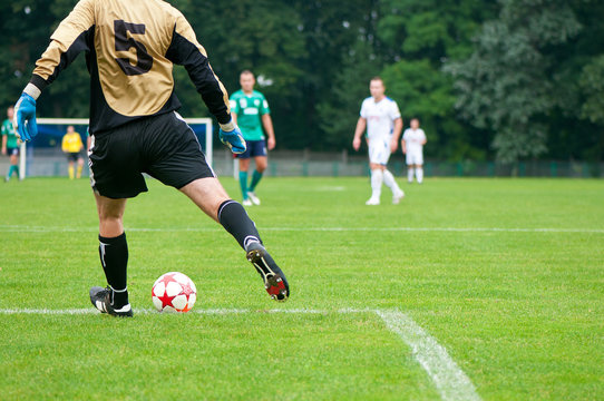 soccer player kicks the ball. Horizontal image of soccer ball wi