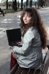 Young business woman with laptop.