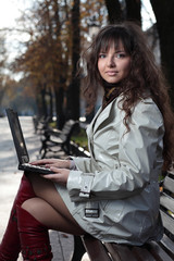 Young business woman with laptop.
