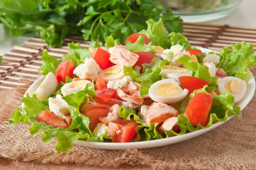 fresh salmon salad, lettuce and quail eggs