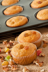 Obraz na płótnie Canvas Muffins with nuts and raisins 