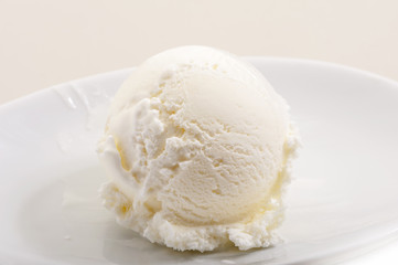 ice cream scoop on white plate close-up