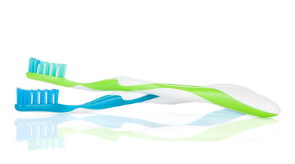 Two colorful toothbrushes