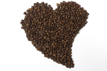Coffee beans lined in the shape of heart