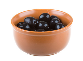 Olives black watered with olive oil in a bowl isolated on a whit