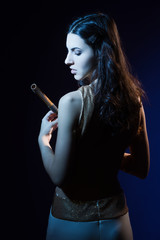 Obraz premium Sensuality brunette with a wooden flute