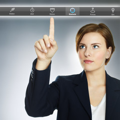 Woman pointing her finger at the button vision