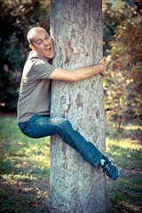 Funny Man Clinging to a Tree