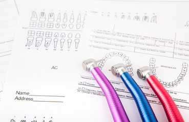 Dental tools and equipment on dental chart